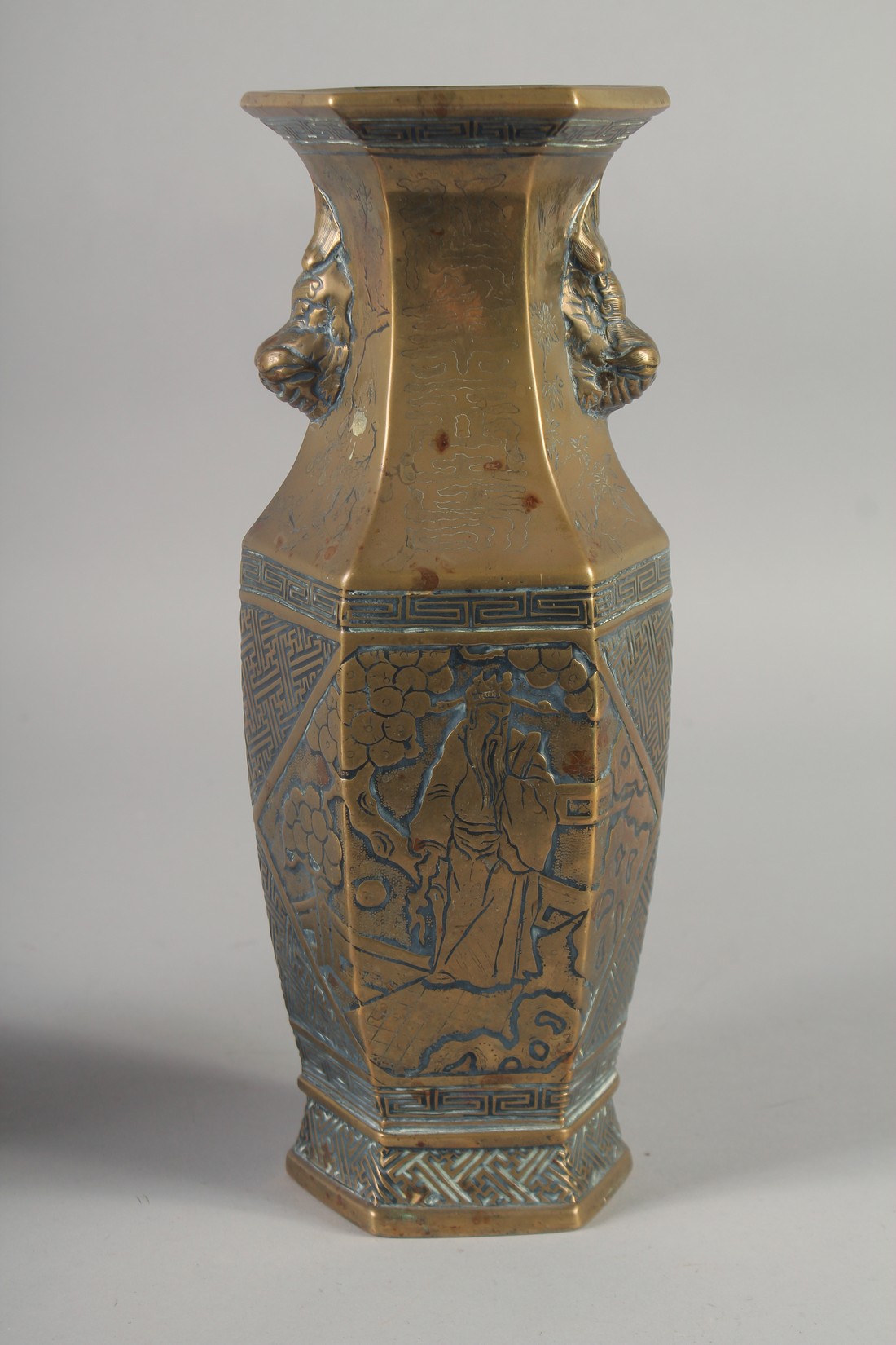 A PAIR OF 19TH CENTURY CHINESE BRONZE HEXAGONAL VASES, engraved with figures and with twin lion - Image 6 of 6