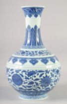 A LARGE CHINESE BLUE AND WHITE PORCELAIN BOTTLE VASE, decorated with large flower heads and vine,