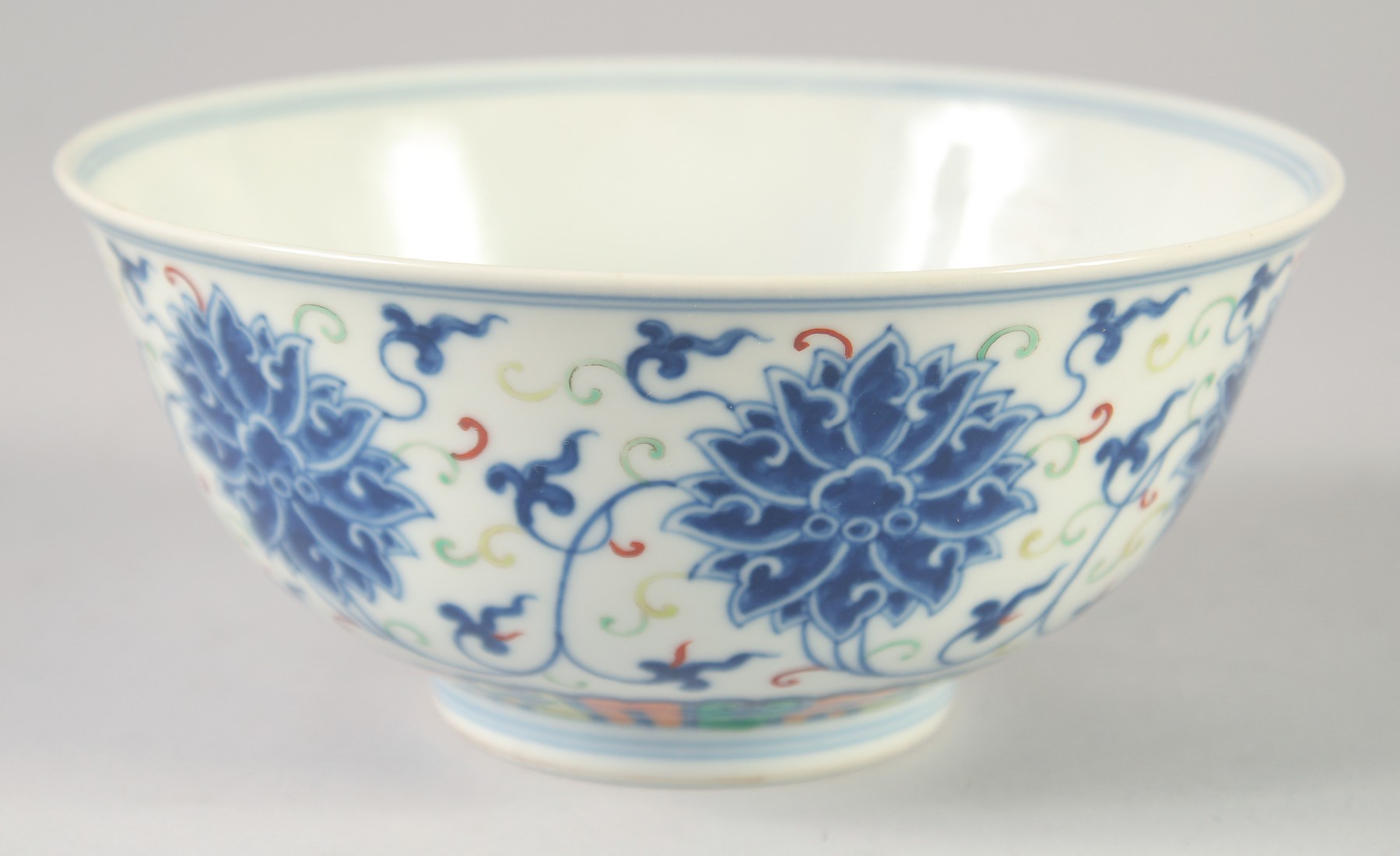 A CHINESE DOUCAI PORCELAIN BOWL, painted with lotus, Guangxu mark to base, 16.5cm diameter.