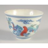 A SMALL CHINESE DOUCAI 'KUI DRAGON' CUP, six-character mark to base, 5.5cm diameter.