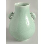 A CHINESE CLAIRE-DE-LUNE CELADON GLAZE TWIN HANDLE VASE, of archaic form with moulded handles and