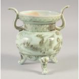 A CHINESE YUAN STYLE UNDER GLAZED RED PHOENIX CENSER, with twin handles and raised three feet,