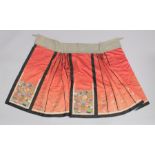 A 19TH CENTURY CHINESE SILK SKIRT, decorated with vases and flowers.