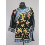 AN EARLY 20TH CHINESE WOMAN'S ROBE, decorated with phoenix and flora and butterflies.