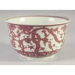A CHINESE UNDER GLAZE RED AND WHITE PORCELAIN BOWL, six-character mark to base, 18cm diameter.