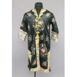 A 20TH CENTURY CHINESE FEMALE ROBE, decorated with flowers and lucky objects.