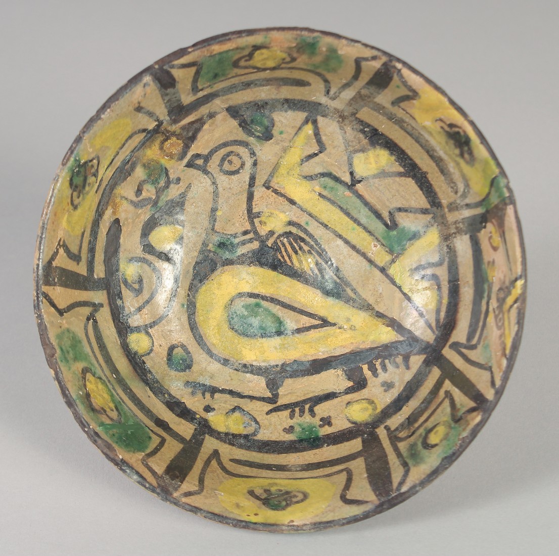 A FINE 9TH-10TH CENTURY PERSIAN NISHAPUR POTTERY BOWL, the interior painted with a bird, 15cm - Image 2 of 3