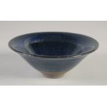 A CHINESE BLUE GLAZE NOGIME TENMOKU POTTERY BOWL, with carved characters two base, 15cm diameter.