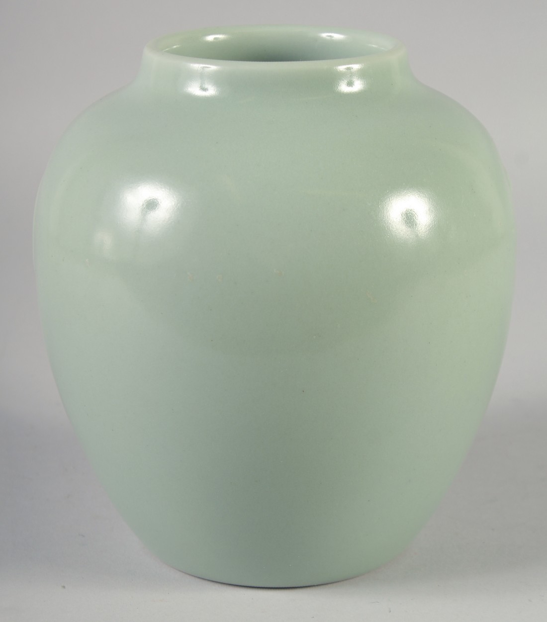 A CHINESE CELADON GLAZE PORCELAIN POT, with Daoguang mark to base, 19cm high.