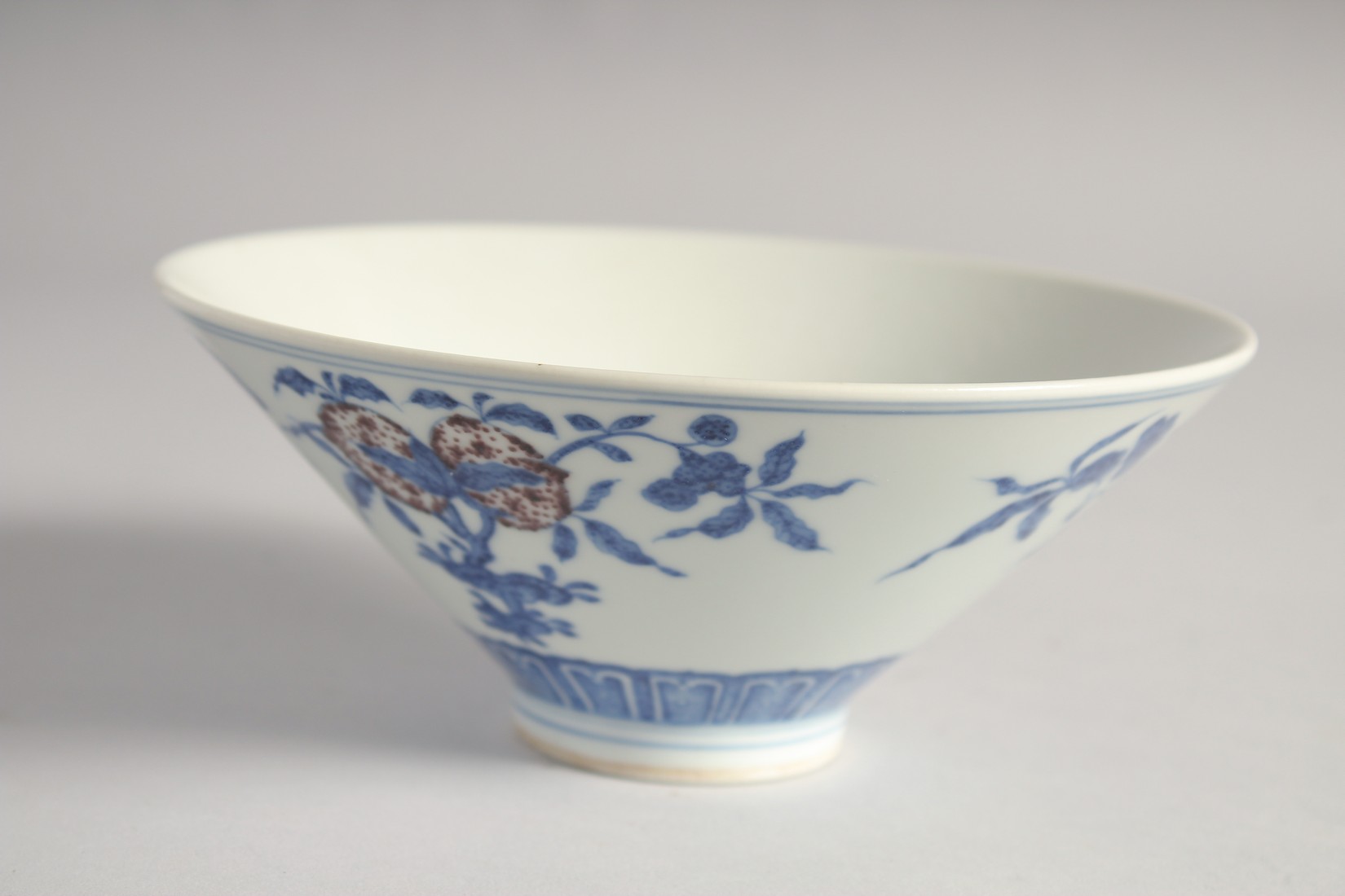 A CHINESE BLUE, WHITE AND UNDERGLAZE RED PORCELAIN BOWL, painted with pomegranate, 16cm diameter. - Image 2 of 6