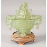 A CARVED JADE KORO AND COVER, with drop ring handles, together with hardwood stand.