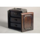 A 20TH CENTURY CHINESE HARDWOOD BOX, with sliding front panel and three interior drawers, 5.1in