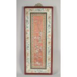 A 19TH CENTURY CHINESE SILK PANEL, of female figures, framed and glazed, textile 66cm x 26cm.