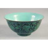 A CHINESE BLACK GLAZE PORCELAIN BOWL, decorated with flowers, the interior with turquoise glaze,