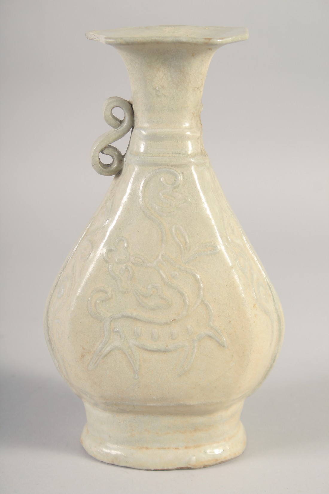 A CHINESE GLAZED POTTERY VASE, with relief decoration, (af) 23cm high.
