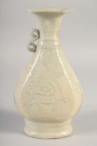 A CHINESE GLAZED POTTERY VASE, with relief decoration, (af) 23cm high.