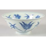 A CHINESE BLUE AND WHITE PORCELAIN BOWL, decorated with large flower heads, six-character mark to