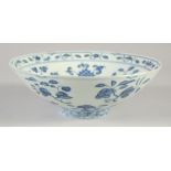 A CHINESE BLUE AND WHITE PORCELAIN BOWL, painted with various fruits and flowers, six-character mark