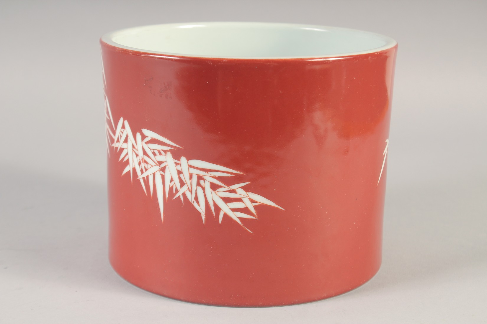 A CHINESE RED GROUND PORCELAIN BRUSH POT, decorated with bamboo, the base with six-character mark, - Image 6 of 6