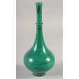 A CHINESE GREEN GLAZE LONG-NECK VASE, with incised decoration, four-character mark to base, 22cm