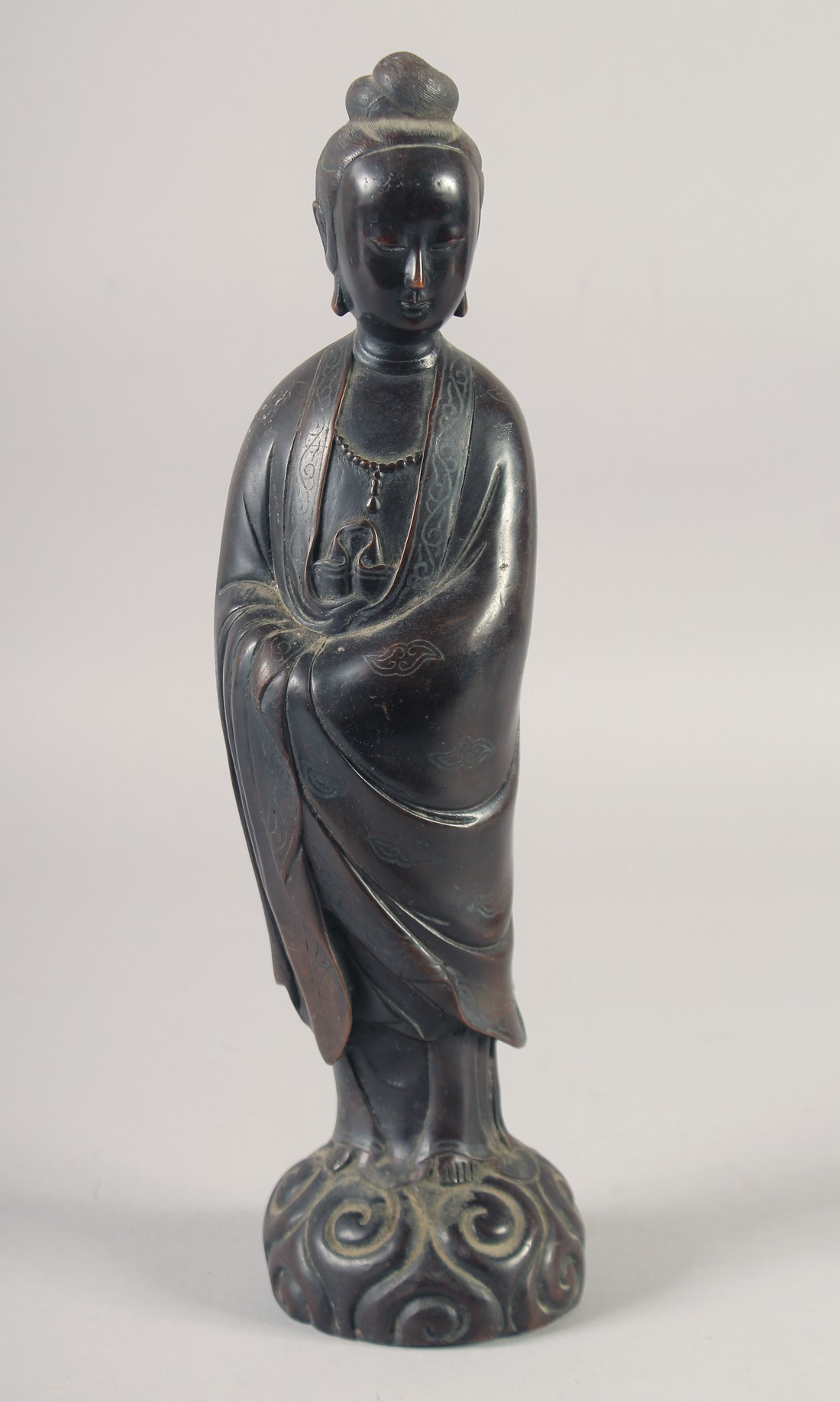 A CHINESE BRONZE FIGURE OF GUANYAN, bearing character mark, 32cm high.