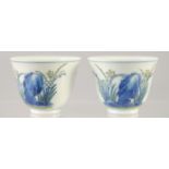 A PAIR OF CHINESE DOUCAI PORCELAIN CUPS, decorated with flora, six-character mark to base, 5cm