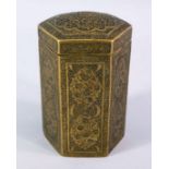 A 19TH CENTURY QAJAR ENGRAVED BRASS HEXAGONAL BOX, with decoration of floral motif, 12.5cm high.