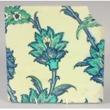 A FINE AND LARGE 16TH-17TH CENTURY OTTOMAN IZNIK OR DAMASCUS TILE, with floral decoration, 25cm