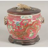 A CHINESE FAMILLE ROSE PORCELAIN CIRCULAR BOWL AND COVER ON STAND, the exterior decorated with