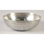 A PERSIAN FINELY ENGRAVED SILVER BOWL, with a band of figures and foliate motifs, weight 80g, 11cm