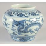 A CHINESE BLUE AND WHITE PORCELAIN DRAGON JAR, 12.5cm high.