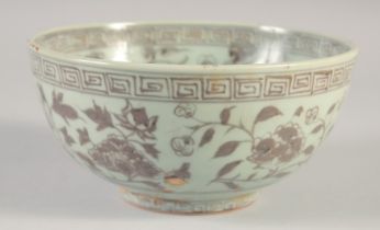 A CHINESE MING STYLE UNDER GLAZE RED PORCELAIN BOWL, 19cm diameter.