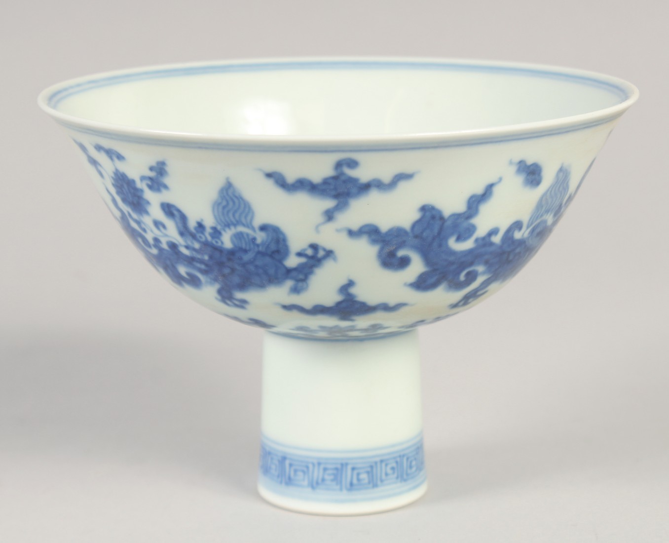 A CHINESE BLUE AND WHITE PORCELAIN 'KUI DRAGON' STEM CUP, six-character mark to inner foot rim, bowl