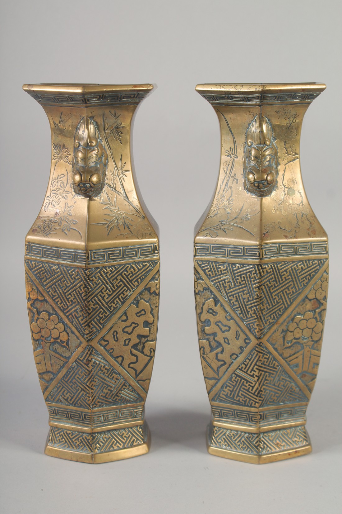 A PAIR OF 19TH CENTURY CHINESE BRONZE HEXAGONAL VASES, engraved with figures and with twin lion - Image 4 of 6