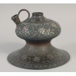 AN 18TH CENTURY INDIAN BIDRI SILVER INLAID HUQQA BASE, with foliate motifs, 20.5cm diameter.