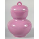 A CHINESE PINK GLAZE PORCELAIN DOUBLE GOURD LIDDED POT, character mark to base, 14cm high.
