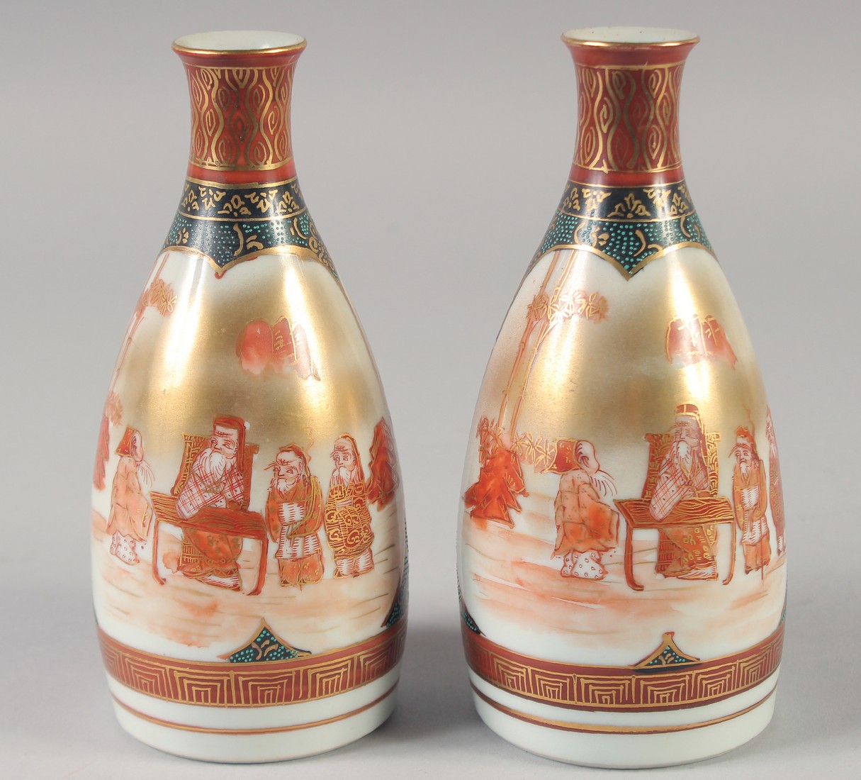 A PAIR OF JAPANESE PORCELAIN SAKE BOTTLES, each with character mark to base, 17cm high.