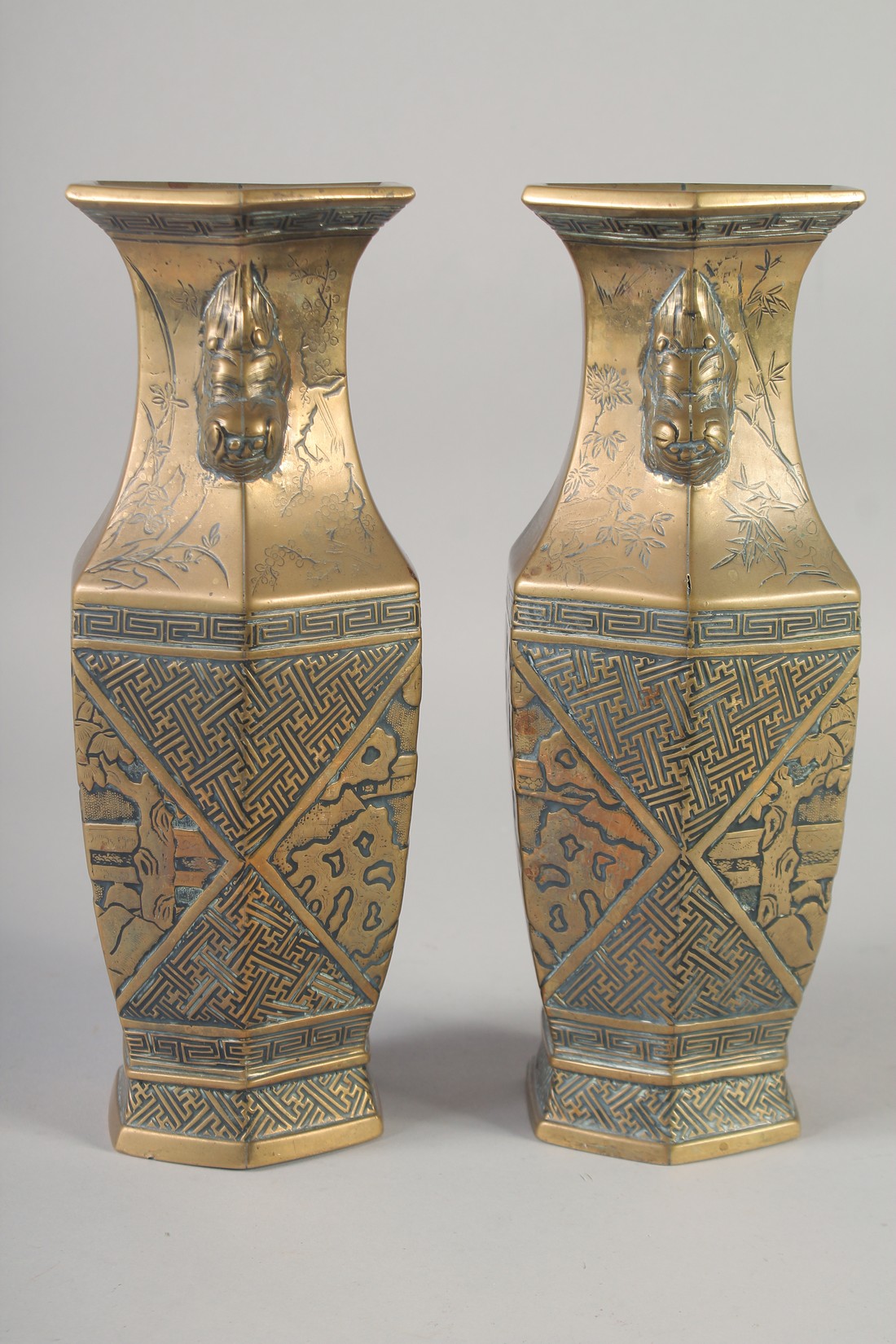 A PAIR OF 19TH CENTURY CHINESE BRONZE HEXAGONAL VASES, engraved with figures and with twin lion - Image 2 of 6