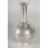 A FINELY ENGRAVED INDIAN OR SOUTH EAST ASIAN WHITE METAL SURAHI BOTTLE, 23cm high.