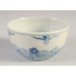 A SMALL CHINESE BLUE AND WHITE PORCELAIN CUP, six-character mark to base, 6cm diameter.