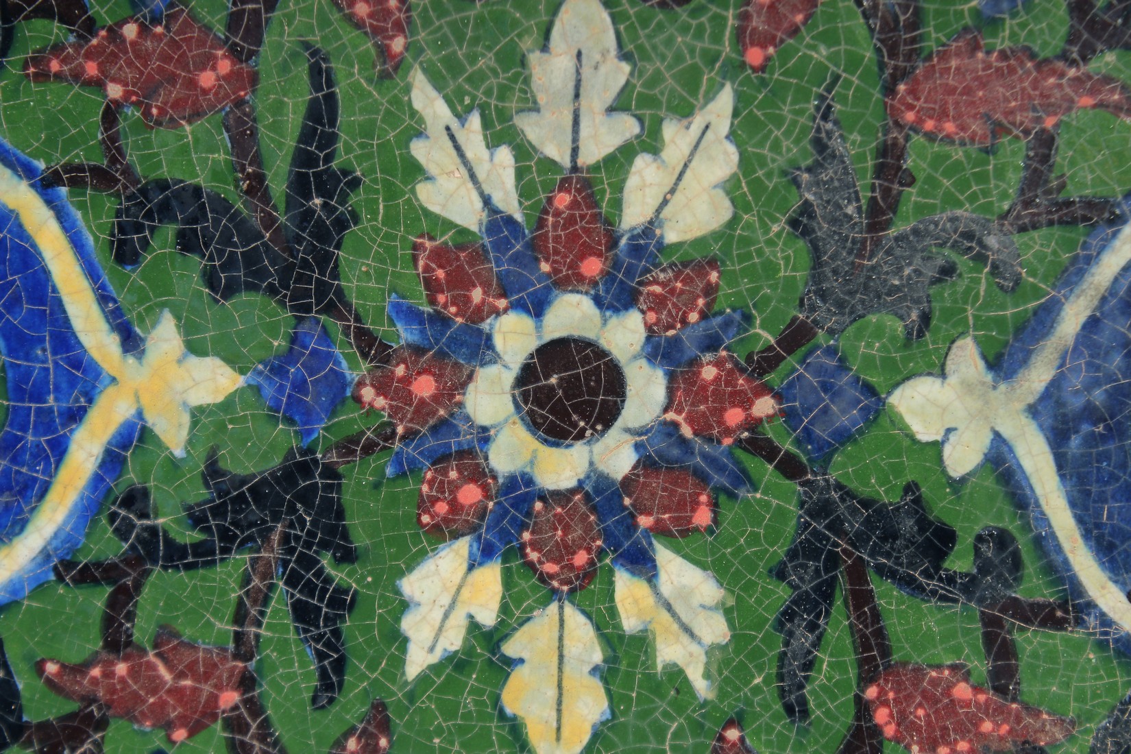 A FINE AND UNUSUAL LARGE 19TH CENTURY INDIAN TILE, with floral motif, 30.5cm square. - Image 2 of 3