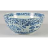 A 19TH CENTURY CHINESE BLUE AND WHITE PORCELAIN BOWL, the exterior painted with figures and flora,