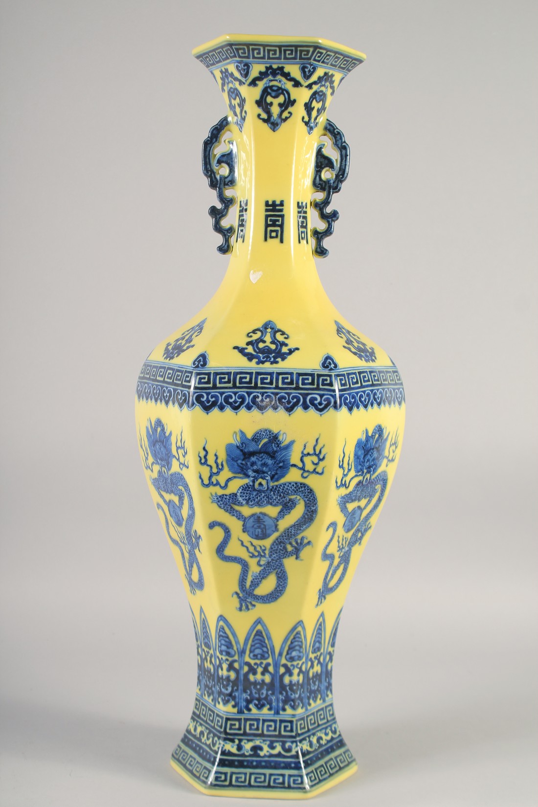 A LARGE CHINESE YELLOW GROUND BLUE AND WHITE HEXAGONAL VASE, with molded twin handles, 58cm high. - Image 3 of 6