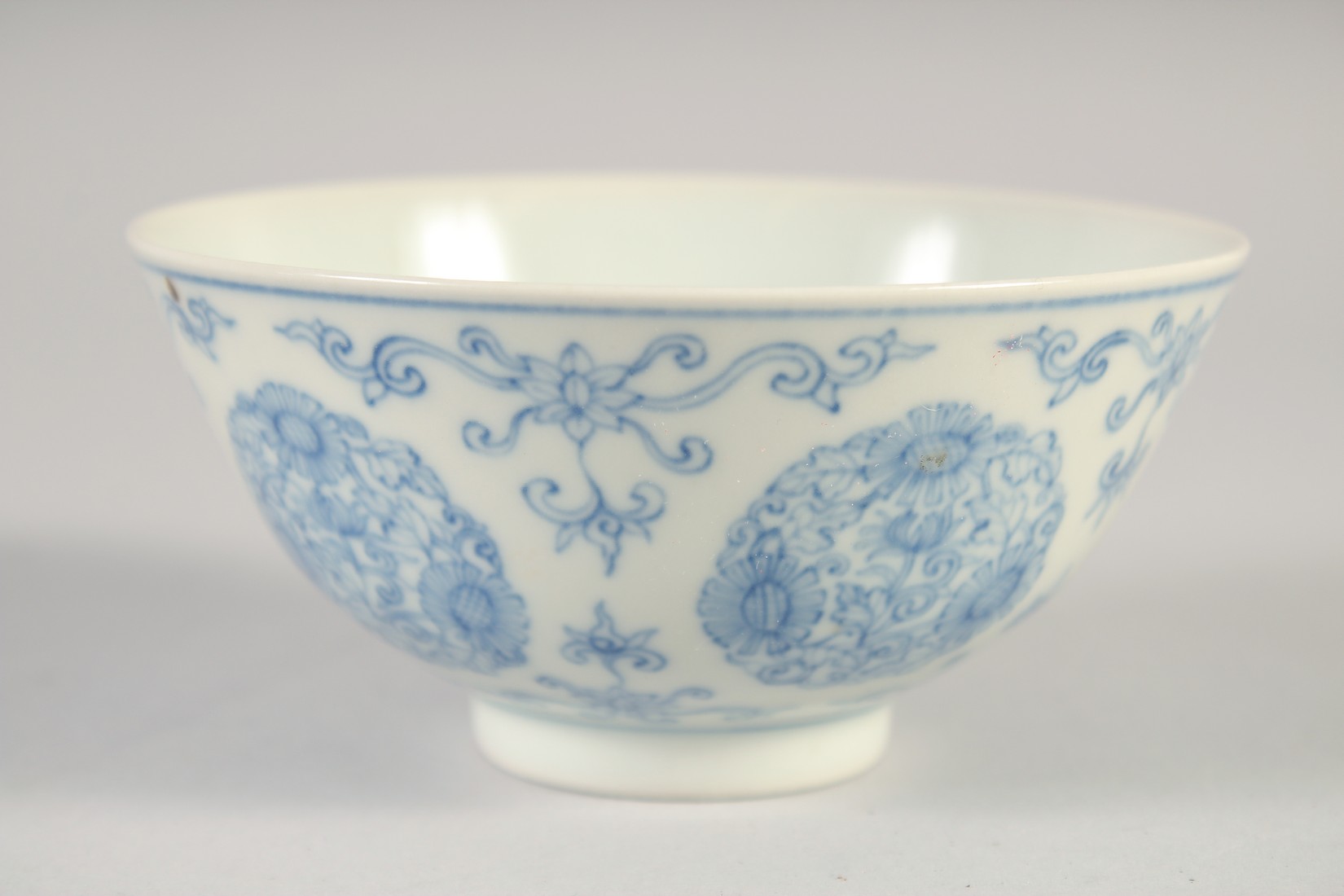 A CHINESE BLUE AND WHITE PORCELAIN BOWL, painted with floral medallions, six-character mark to base, - Image 2 of 5