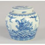 A CHINESE BLUE AND WHITE GINGER JAR AND COVER, decorated with mythological beasts, 12cm high.