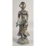 A LARGE 19TH-20TH CENTURY INDIAN SILVER FIGURE OF A FEMALE DRUMMER, on a domed base, her head and