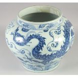 A LARGE CHINESE BLUE AND WHITE PORCELAIN JARDINIERE, decoration with a dragon and stylised clouds,
