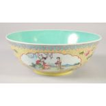 A CHINESE YELLOW GROUND FAMILLE ROSE PORCELAIN BOWL, with panels of female figures and further