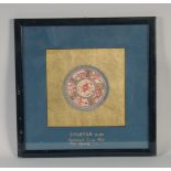 A 19TH CENTURY CHINESE EMBROIDERED TEA CUP MAT, framed and glazed, frame 36cm square.