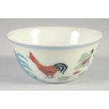 A CHINESE DOUCAI PORCELAIN CHICKEN CUP, six-character mark to base, 8cm diameter.